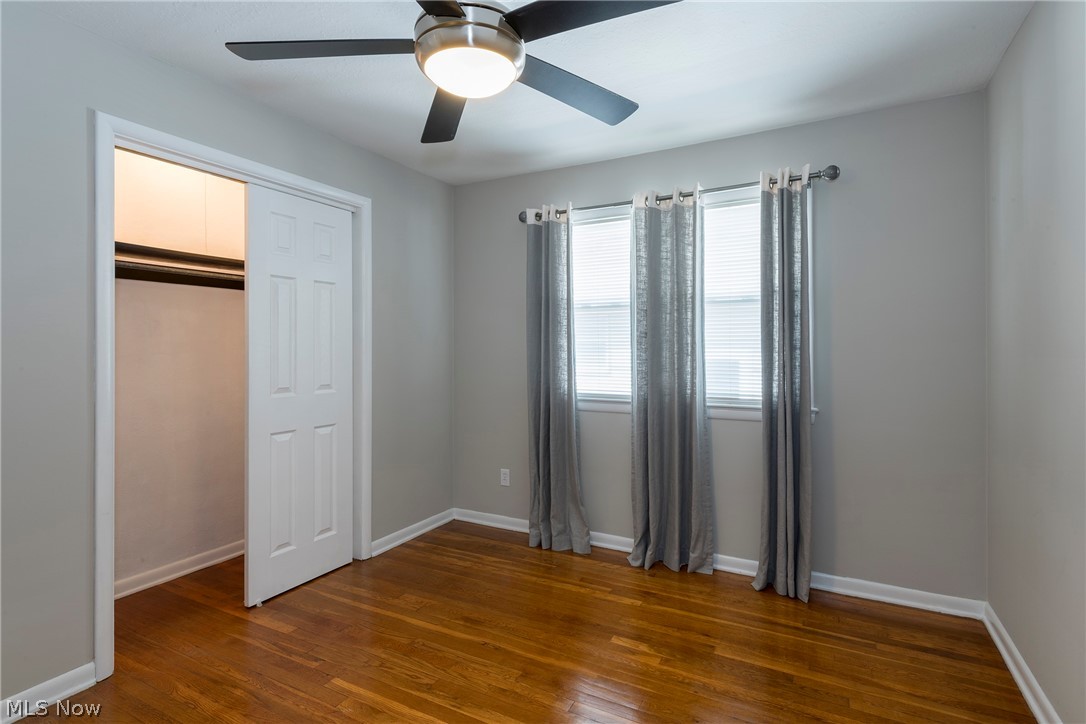 13175 McCracken Road Cleveland, OH 44125 - Photo 16 of 48 Bedroom featuring a closet, ceiling fan, and dark hardwood / wood-style flooring