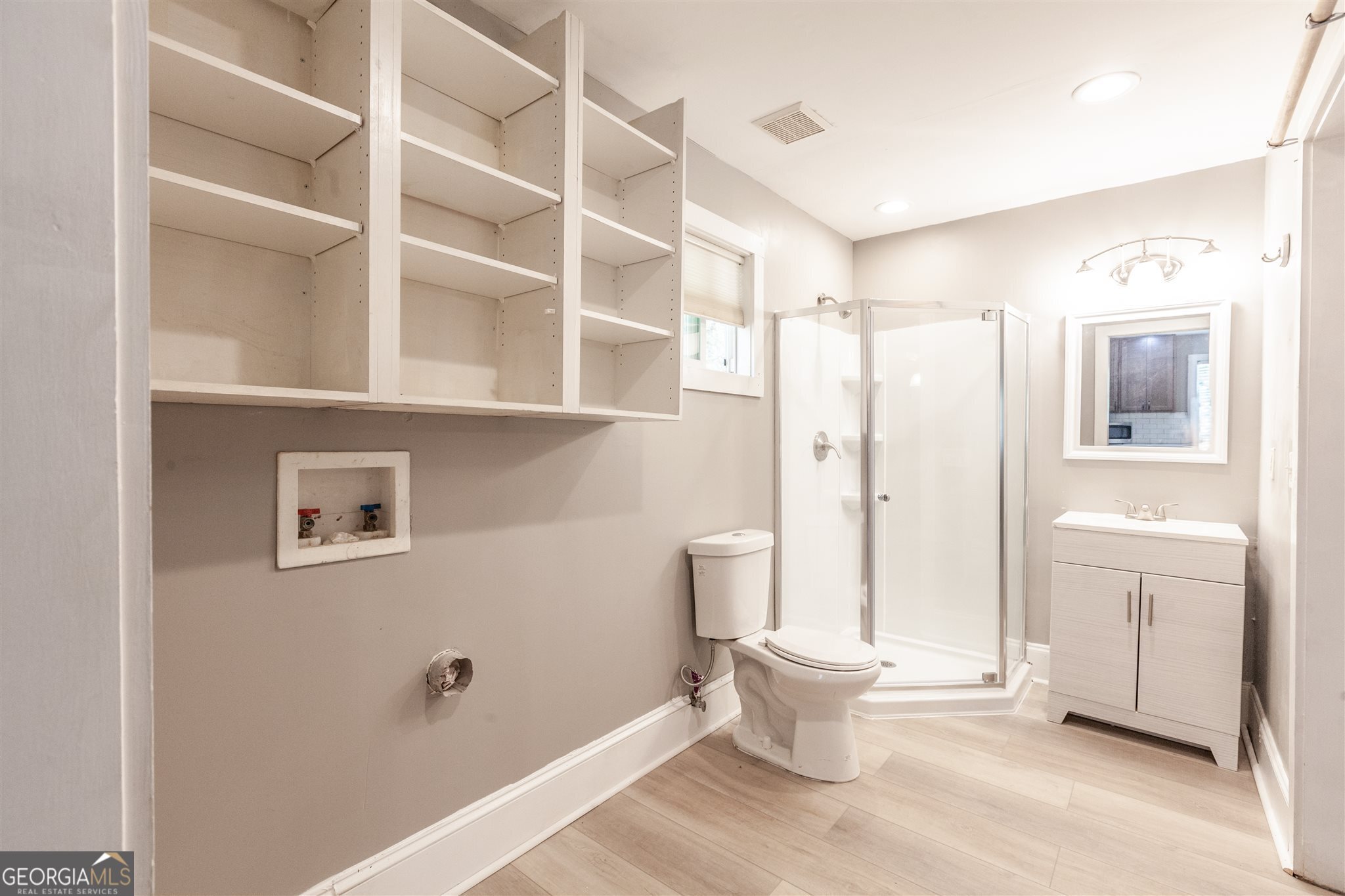 45 Bridge Street Senoia, GA 30276 - Photo 12 of 19 a bathroom with a toilet sink and a shower