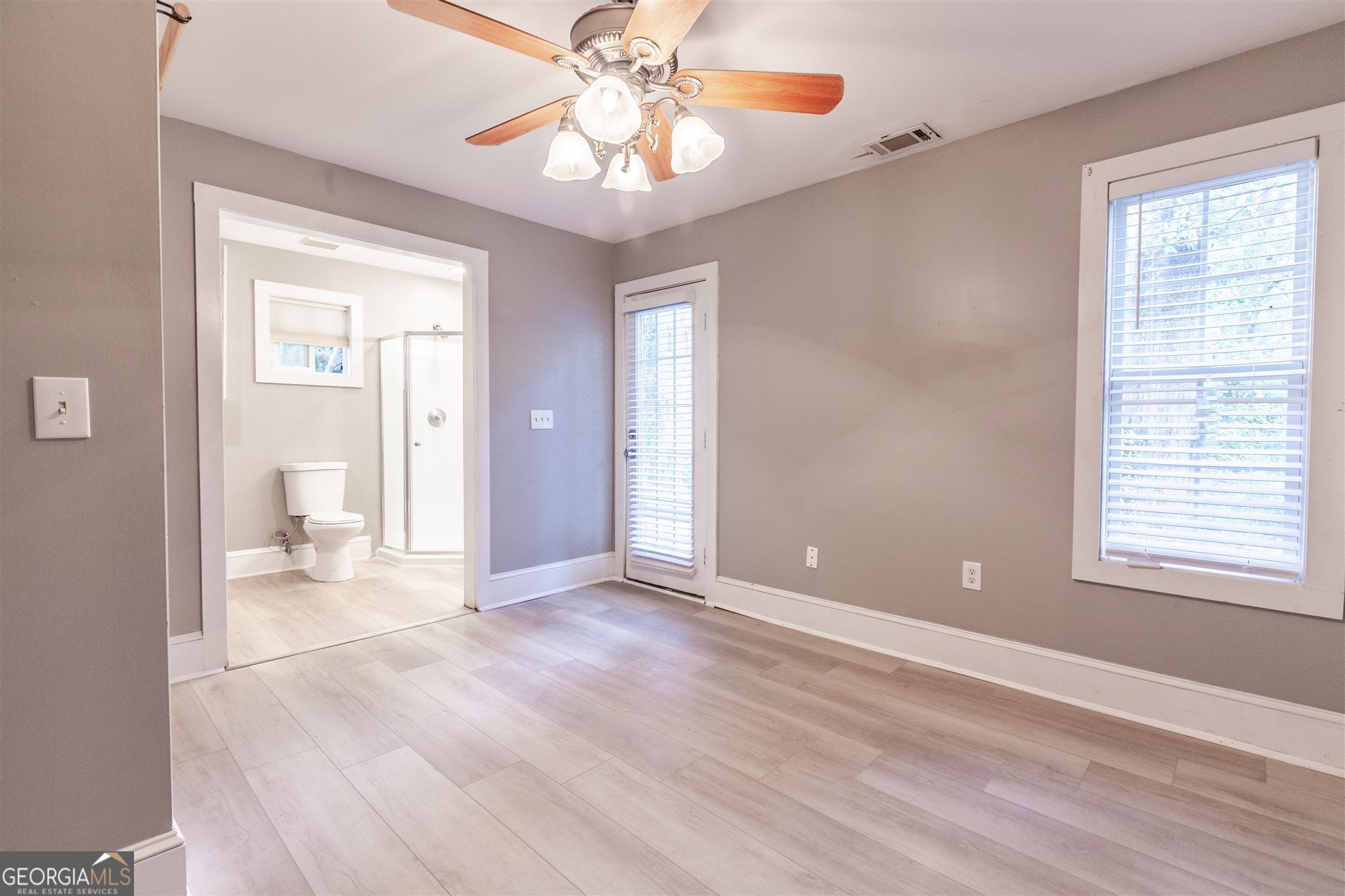 45 Bridge Street Senoia, GA 30276 - Photo 15 of 19 a view of an empty room with wooden floor and a window