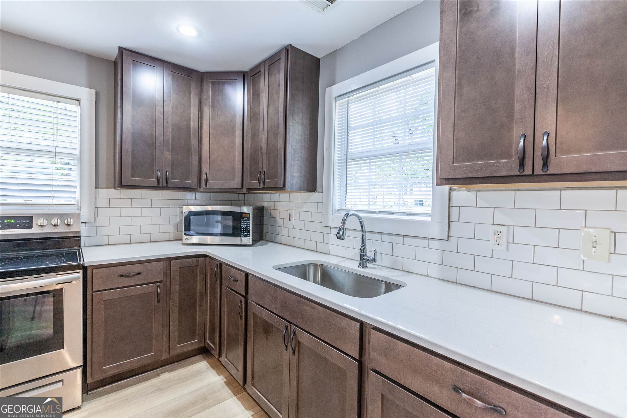 45 Bridge Street Senoia, GA 30276 - Photo 8 of 19 a kitchen with a sink cabinets and window