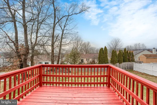 a view of balcony with wooden fence