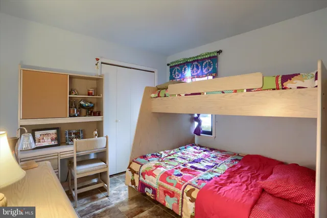 a bedroom with a bed and closet