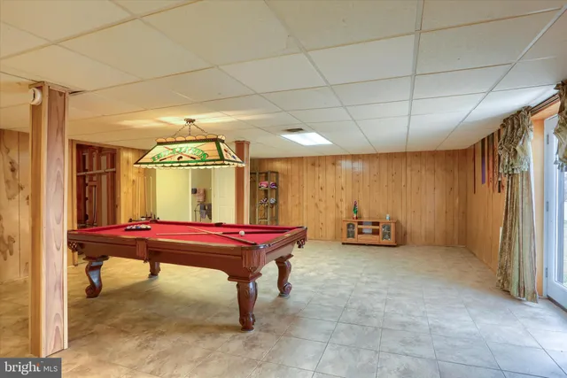 a room with lots of furniture and a wooden floor