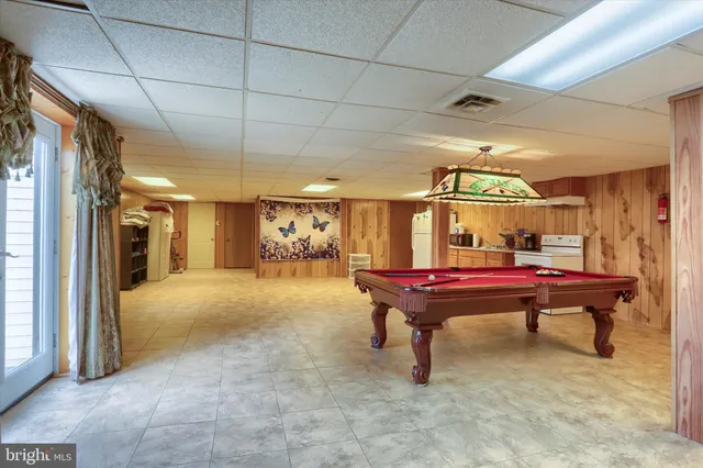 a bathroom with a granite countertop sink mirror and