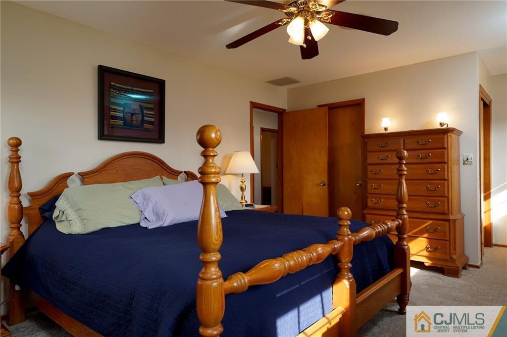 203 Crosswicks Ellisdale Road Chesterfield, NJ 08515 - Photo 20 of 25 a bedroom with a bed and wooden floor