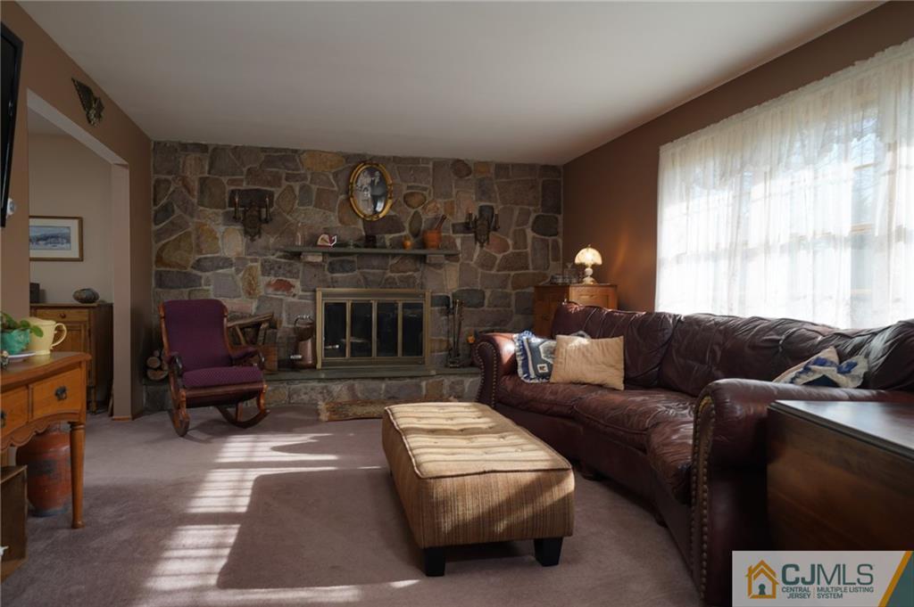 203 Crosswicks Ellisdale Road Chesterfield, NJ 08515 - Photo 3 of 25 a living room with furniture and a fireplace