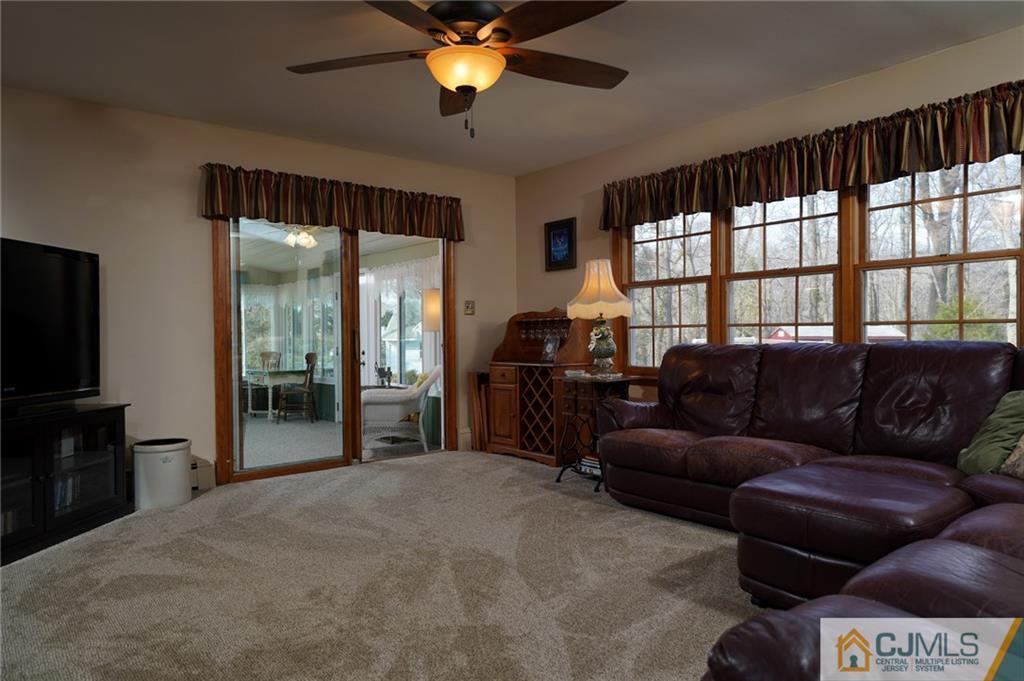 203 Crosswicks Ellisdale Road Chesterfield, NJ 08515 - Photo 8 of 25 a living room with furniture and a flat screen tv