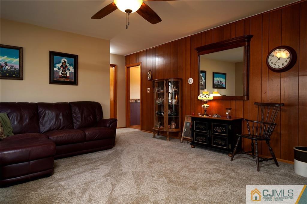 203 Crosswicks Ellisdale Road Chesterfield, NJ 08515 - Photo 9 of 25 a living room with furniture and a flat screen tv