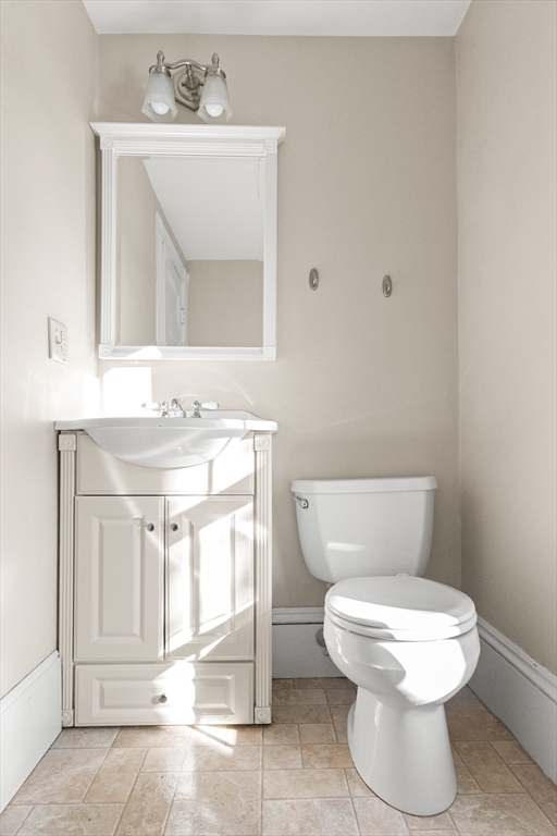 23 Proctor Street Salem, MA 01970 - Photo 18 of 41 a bathroom with a toilet sink and mirror