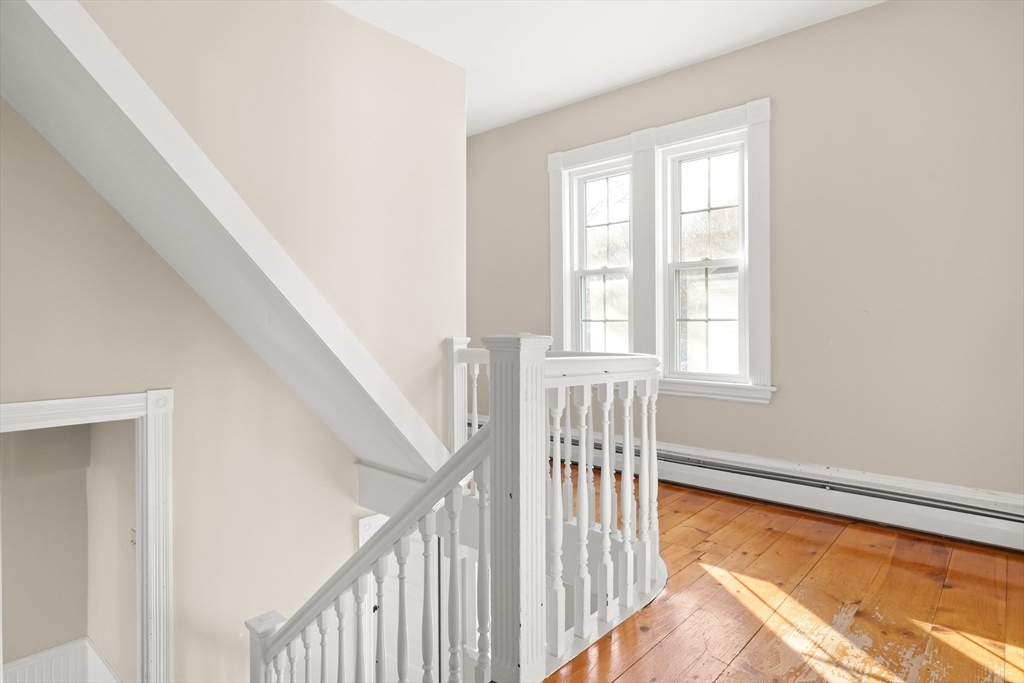 23 Proctor Street Salem, MA 01970 - Photo 21 of 41 a view of a room with wooden floor and windows