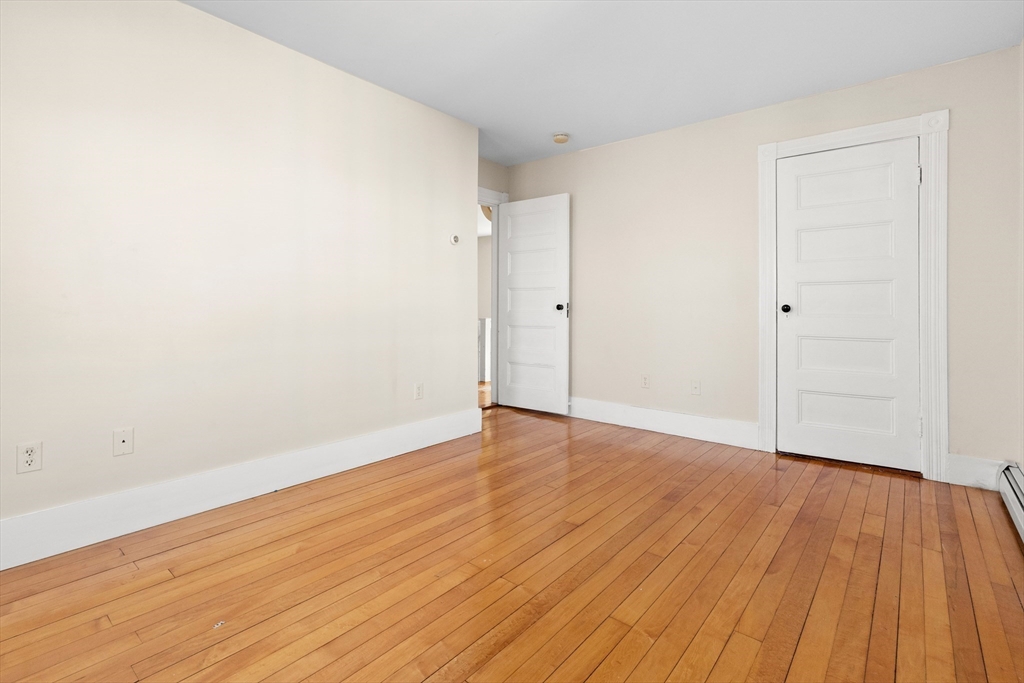 23 Proctor Street Salem, MA 01970 - Photo 23 of 41 a view of an empty room with wooden and a window
