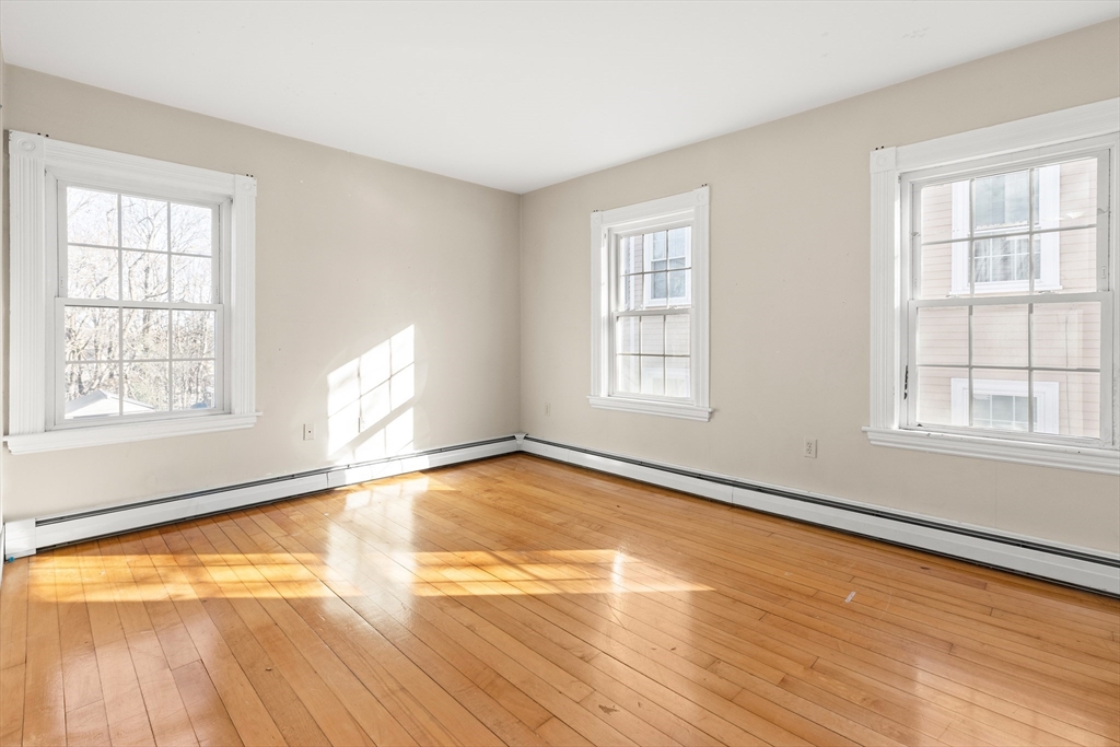 23 Proctor Street Salem, MA 01970 - Photo 25 of 41 a view of an empty room with wooden floor and a window