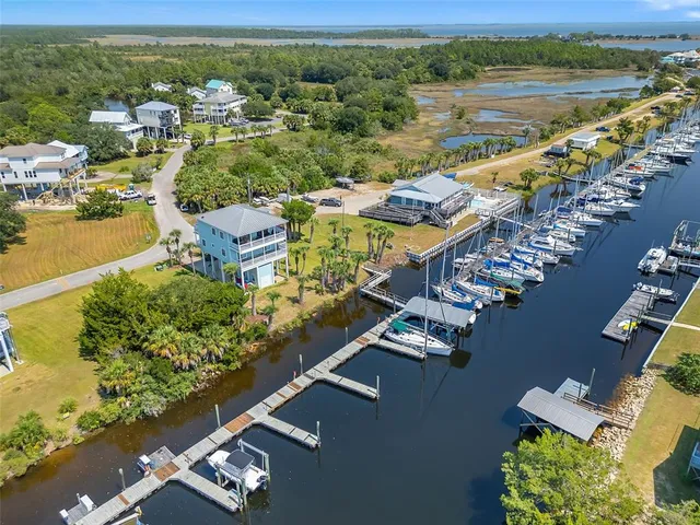 an aerial view of a house with a lake view
