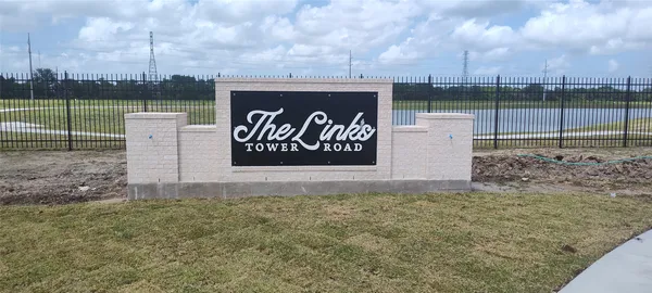 a view of a park with a sign board