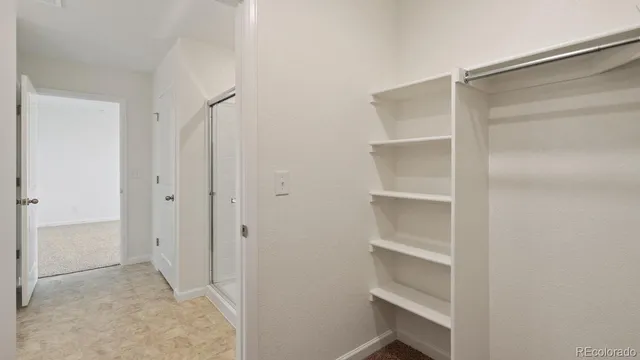 a view of an empty walk in closet