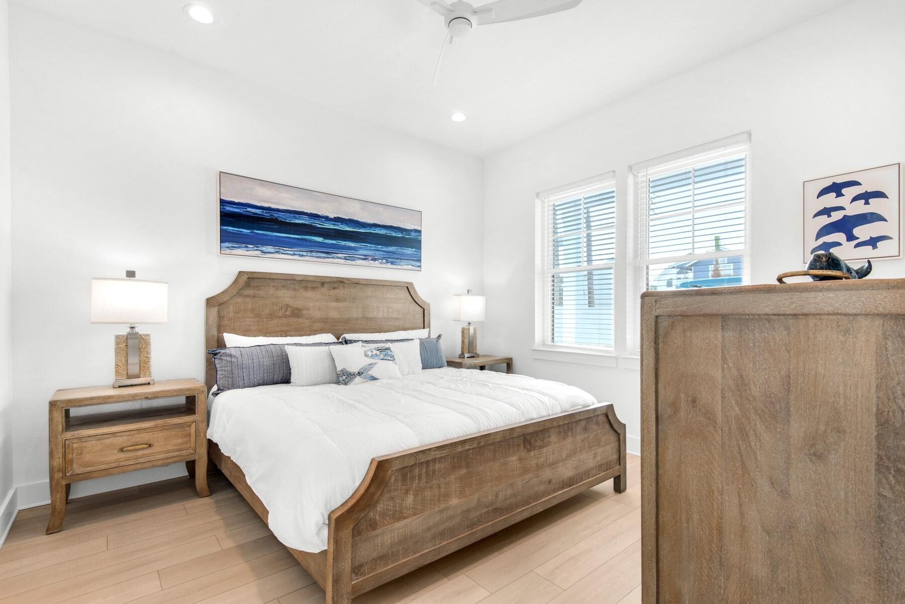 65 Cobia Street Destin, FL 32541 - Photo 16 of 54 a bedroom with a bed and a window