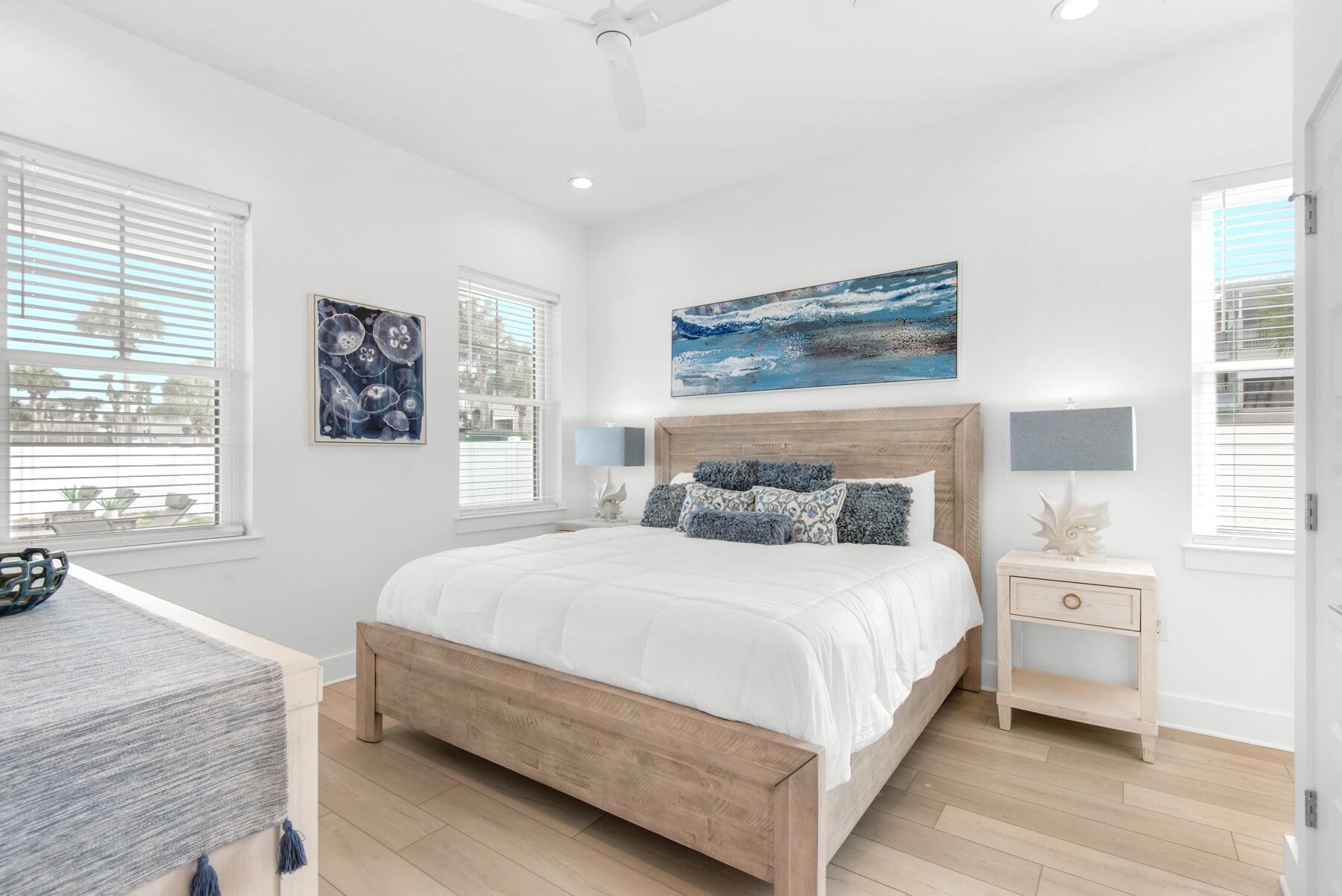 65 Cobia Street Destin, FL 32541 - Photo 20 of 54 a bedroom with a large bed and a window