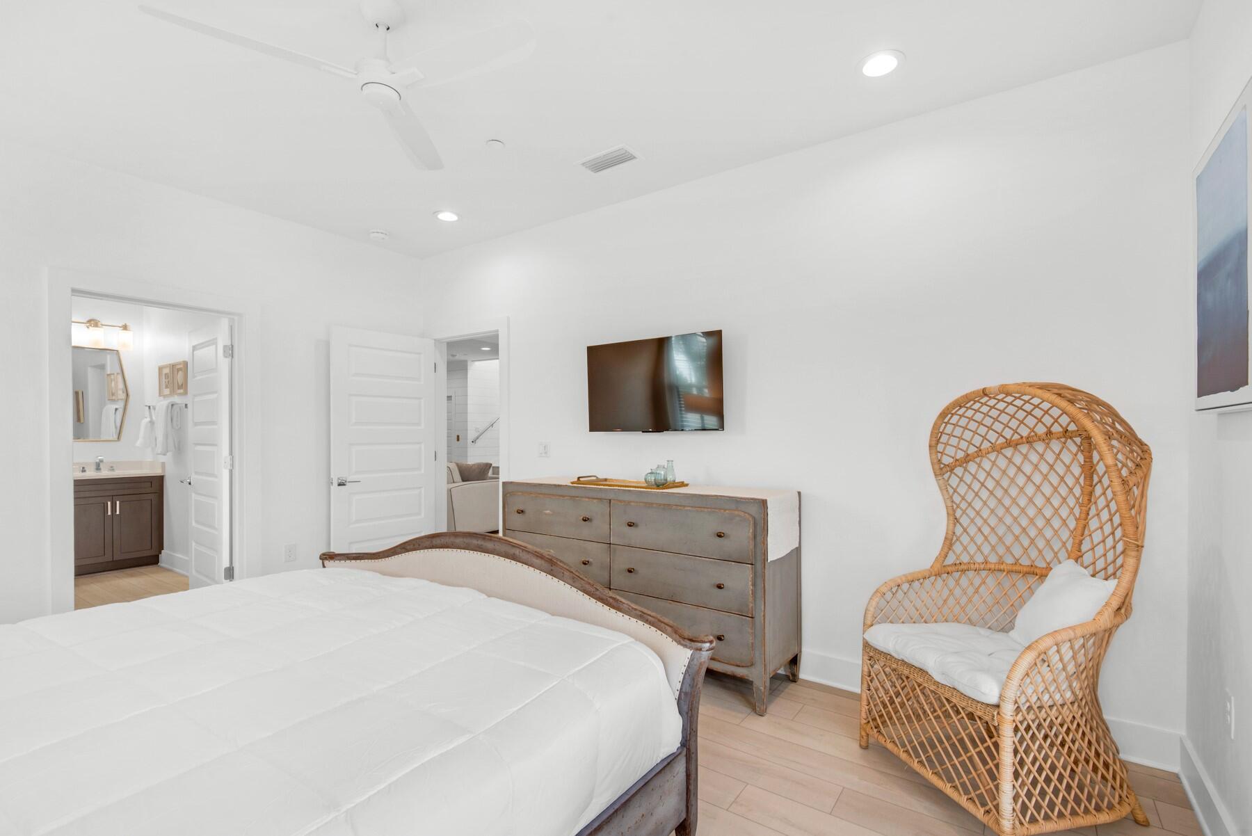 65 Cobia Street Destin, FL 32541 - Photo 29 of 54 a bedroom with a bed and a flat screen tv
