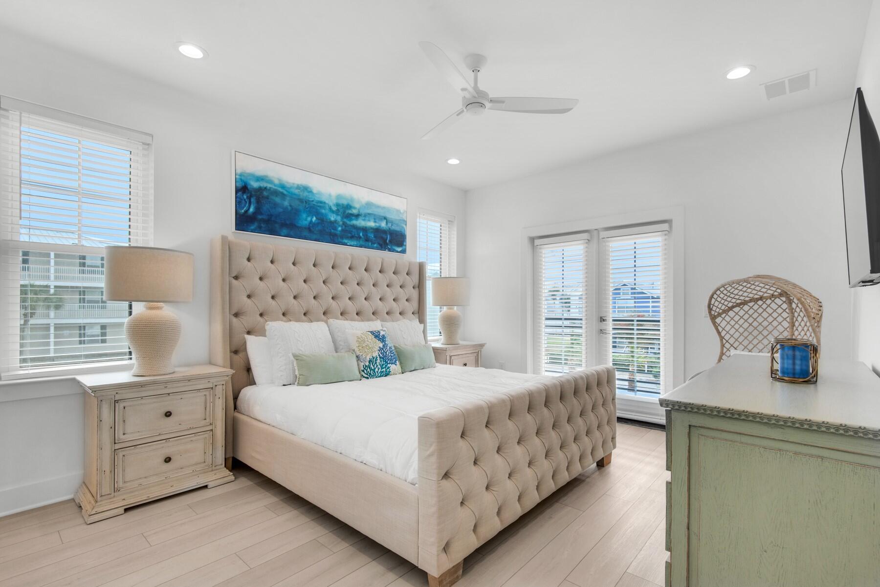65 Cobia Street Destin, FL 32541 - Photo 32 of 54 a bedroom with a bed and a dresser