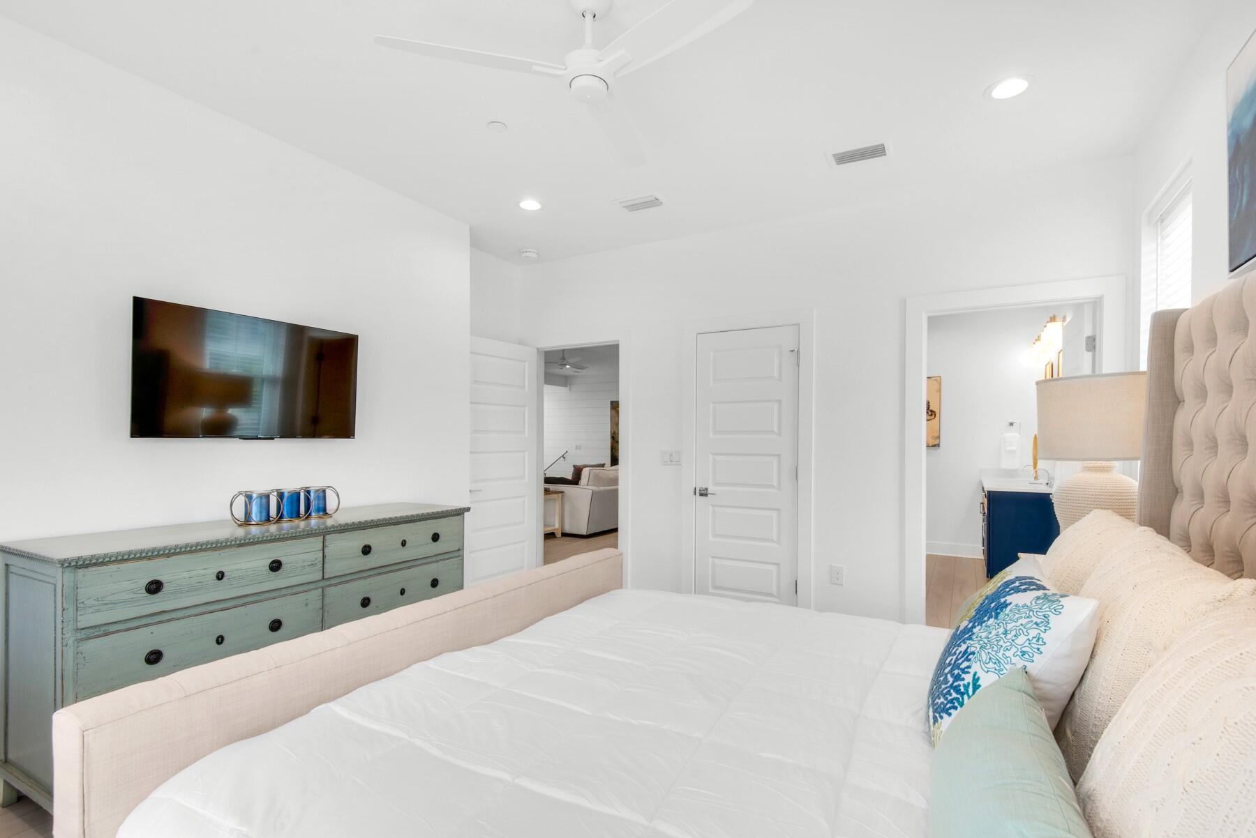 65 Cobia Street Destin, FL 32541 - Photo 33 of 54 a bedroom with a bed and a flat screen tv