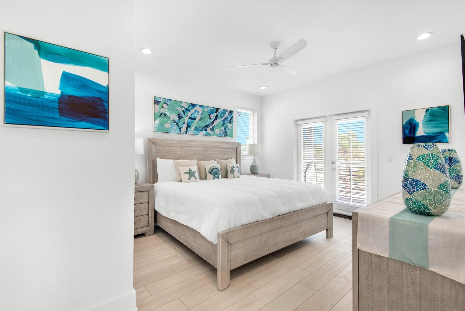 65 Cobia Street Destin, FL 32541 - Photo 36 of 54 a bed sitting in a spacious bedroom next to a window
