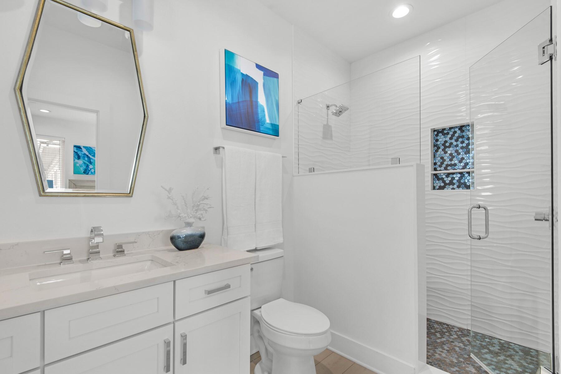 65 Cobia Street Destin, FL 32541 - Photo 38 of 54 a bathroom with a granite countertop sink a toilet and a mirror