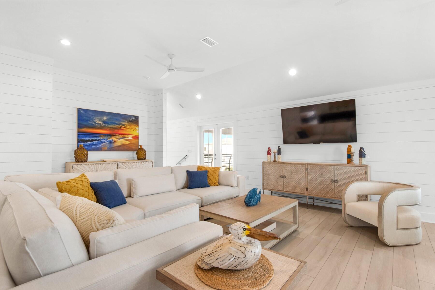 65 Cobia Street Destin, FL 32541 - Photo 39 of 54 a living room with furniture and a flat screen tv