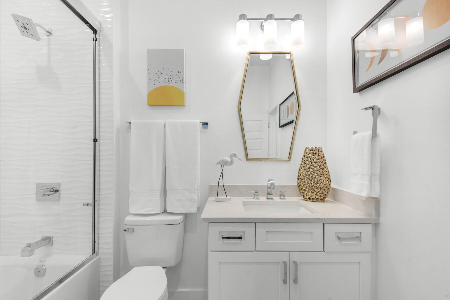 65 Cobia Street Destin, FL 32541 - Photo 44 of 54 a bathroom with a sink vanity mirror and toilet