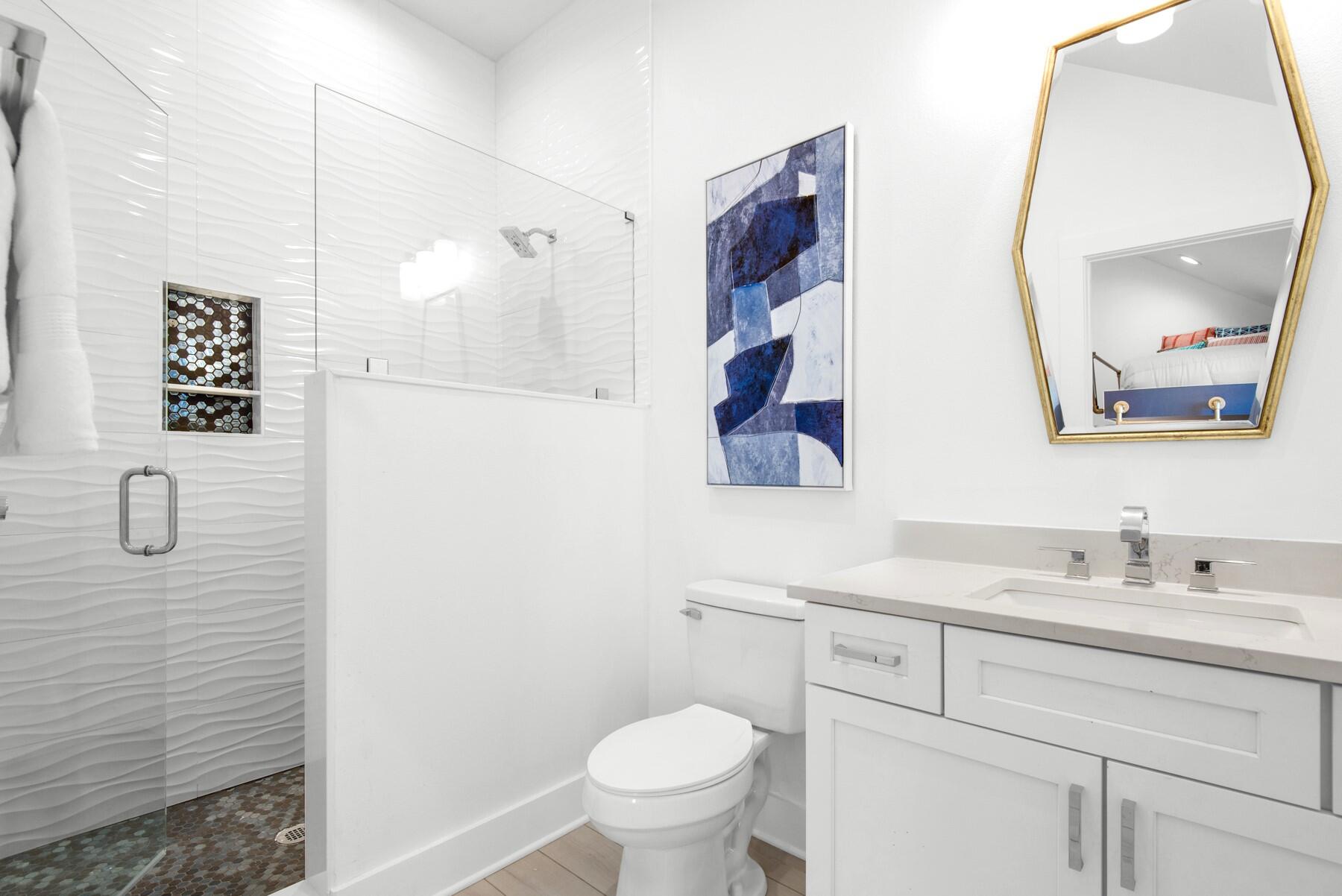 65 Cobia Street Destin, FL 32541 - Photo 49 of 54 a bathroom with a toilet sink and mirror