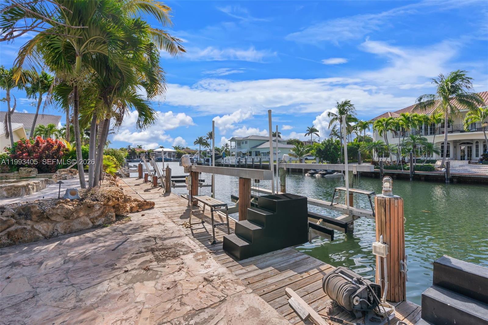 2858 Northeast 33rd Street Lighthouse Point, FL 33064 - Photo 10 of 24 a view of a lake with a patio