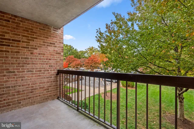 a view of a balcony with a pot
