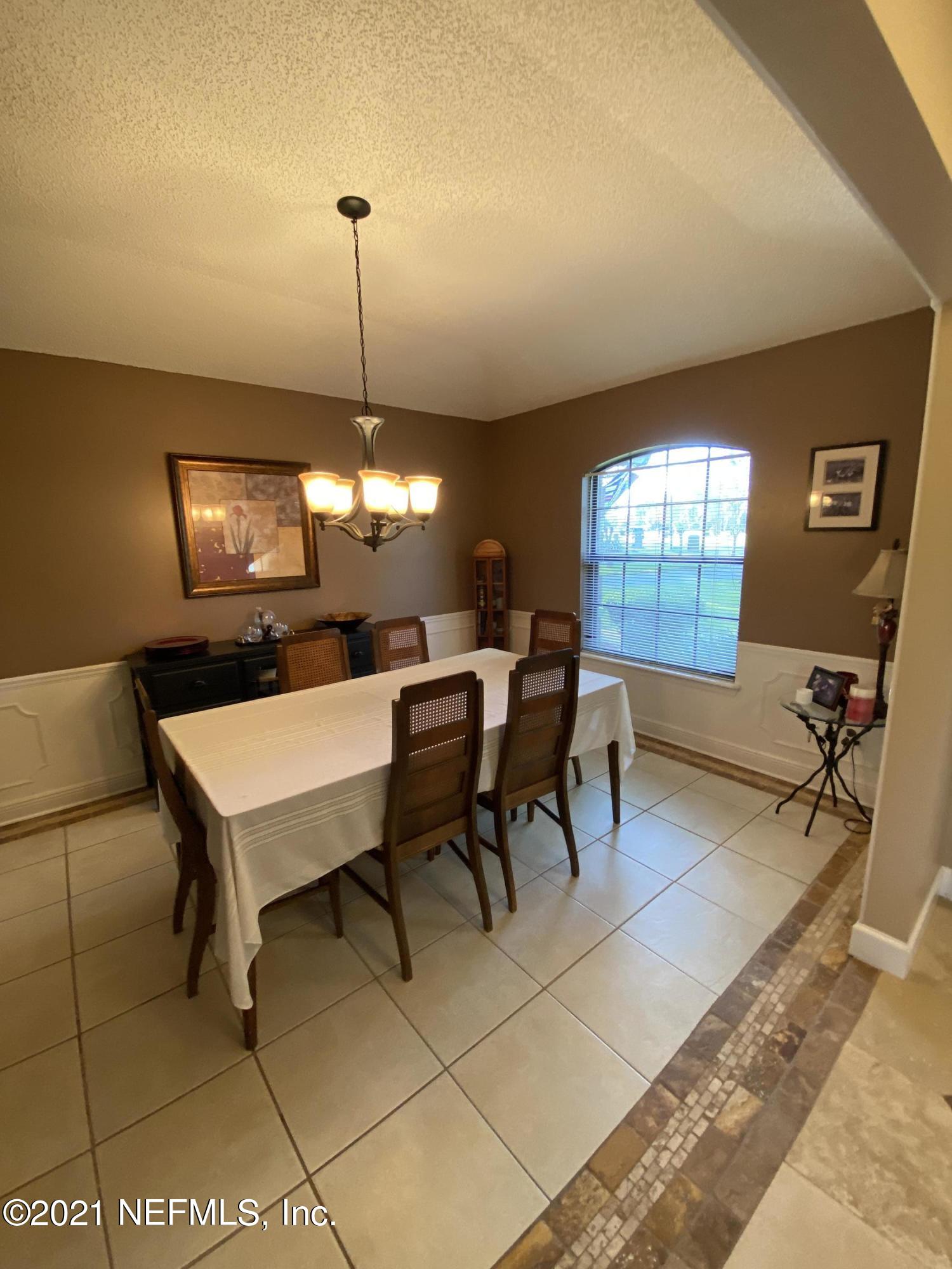 3021 Nautilus Road Middleburg, FL 32068 - Photo 16 of 25 a dining room with furniture and window