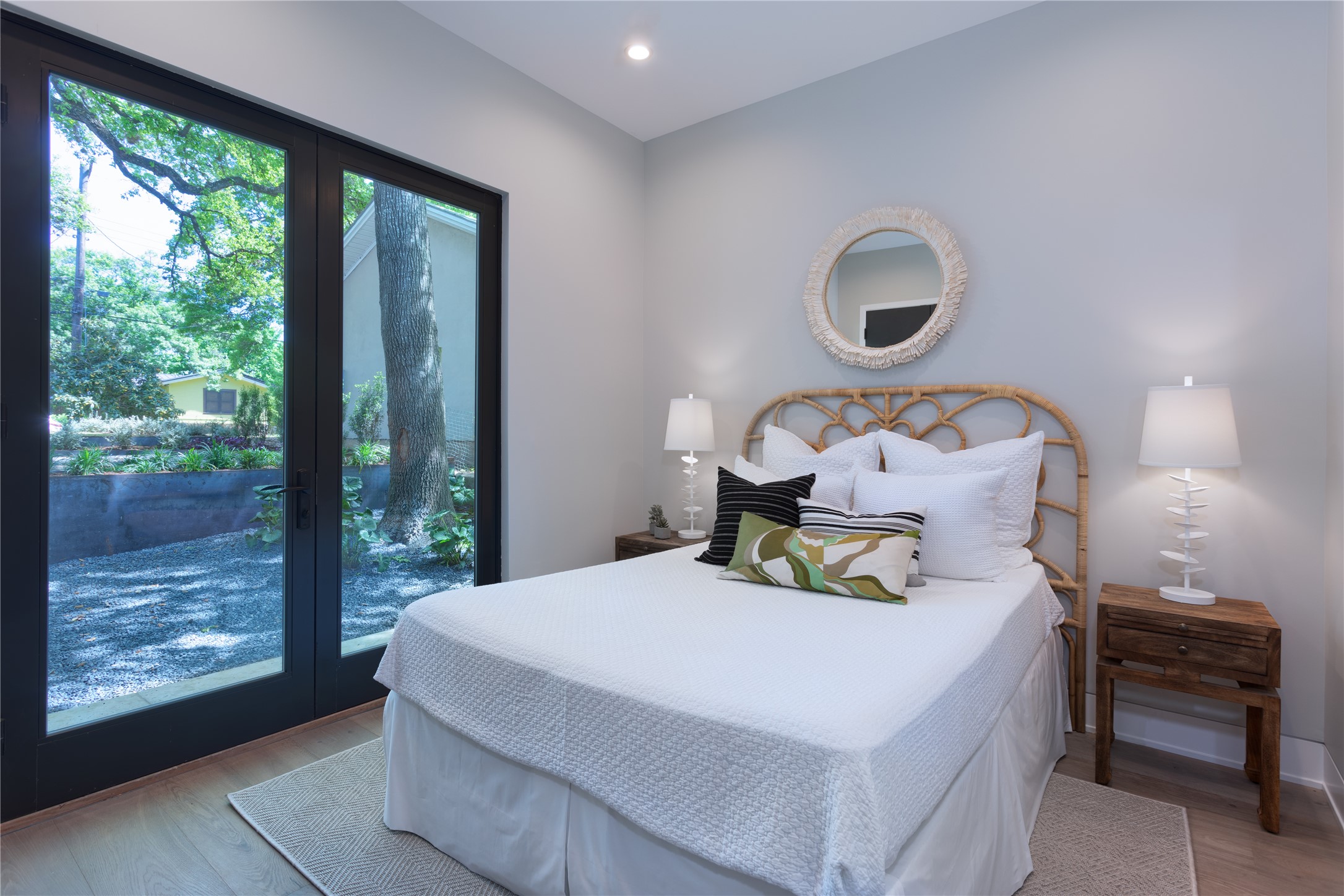 700 Jessie Street Austin, TX 78704 - Photo 15 of 40 Bedroom with light wood-style floors, recessed lighting, and access to exterior