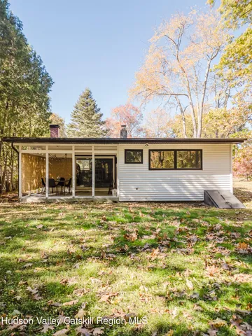 a sign that is sitting in front of a house