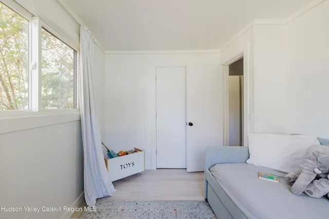 a room with a bed and a window