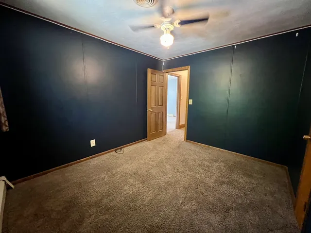 wooden floor and window in an empty room