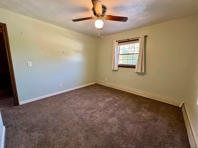 a view of outdoor space with wooden floor