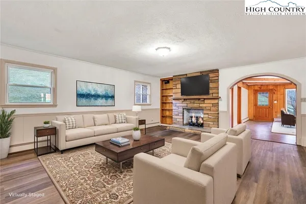 a kitchen with a refrigerator and a stove top oven
