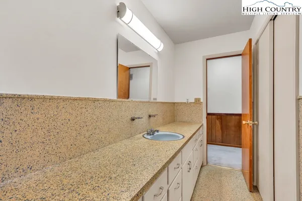 a view of empty room with closet and fan