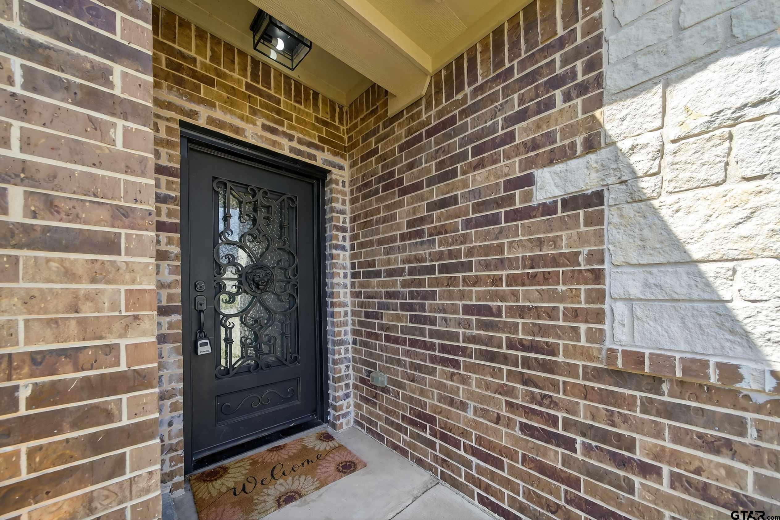 23001 Red Azalea Lane Lindale, TX 75771 - Photo 4 of 35 a brick building with a window