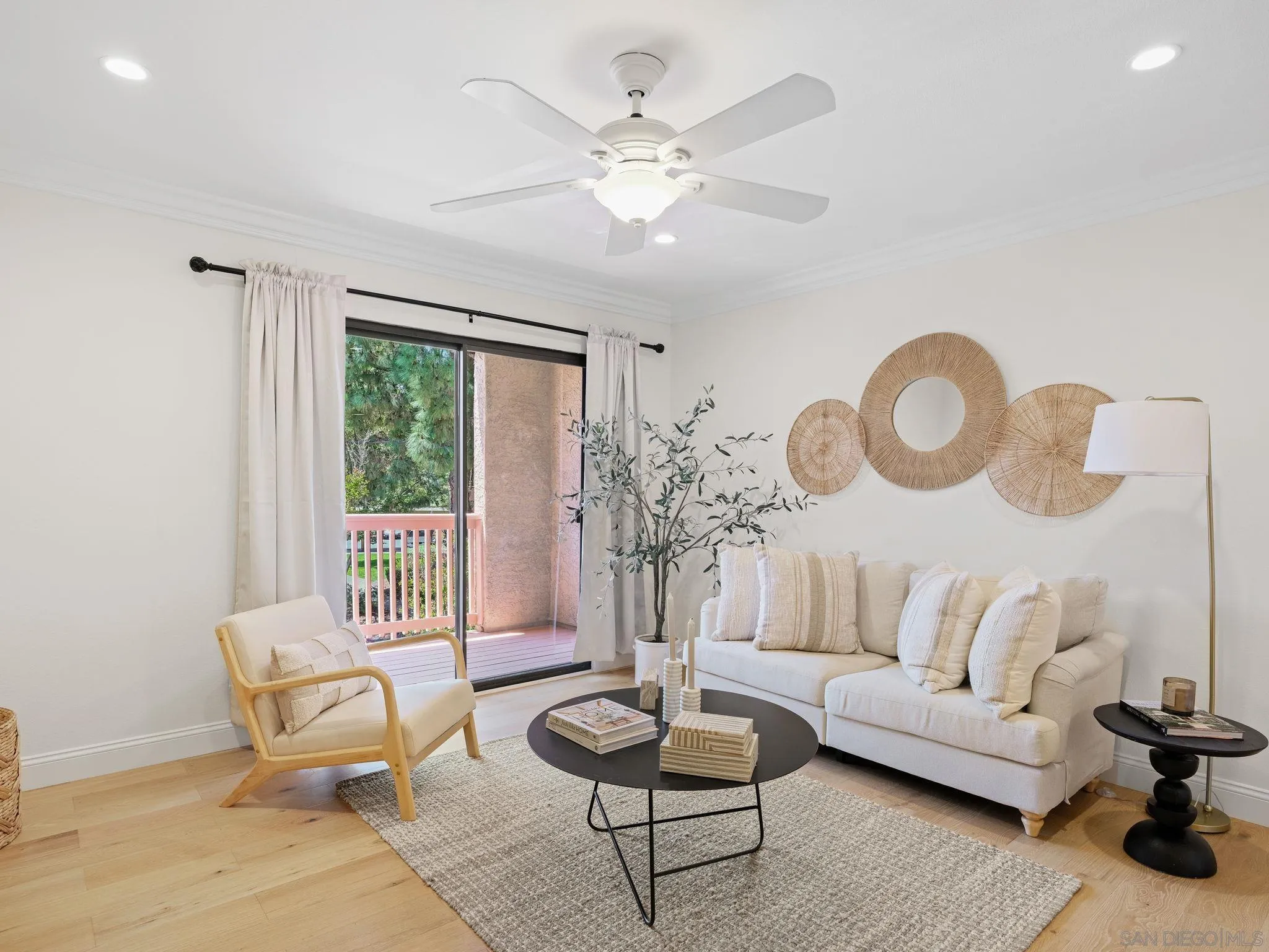 12023 Alta Carmel Court, Unit 244 San Diego, CA 92128 - Photo 2 of 9 a living room with furniture and a large window