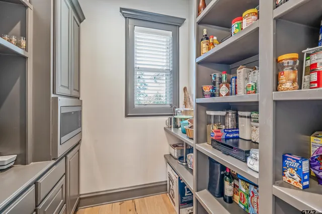 a room with toys and a book shelf