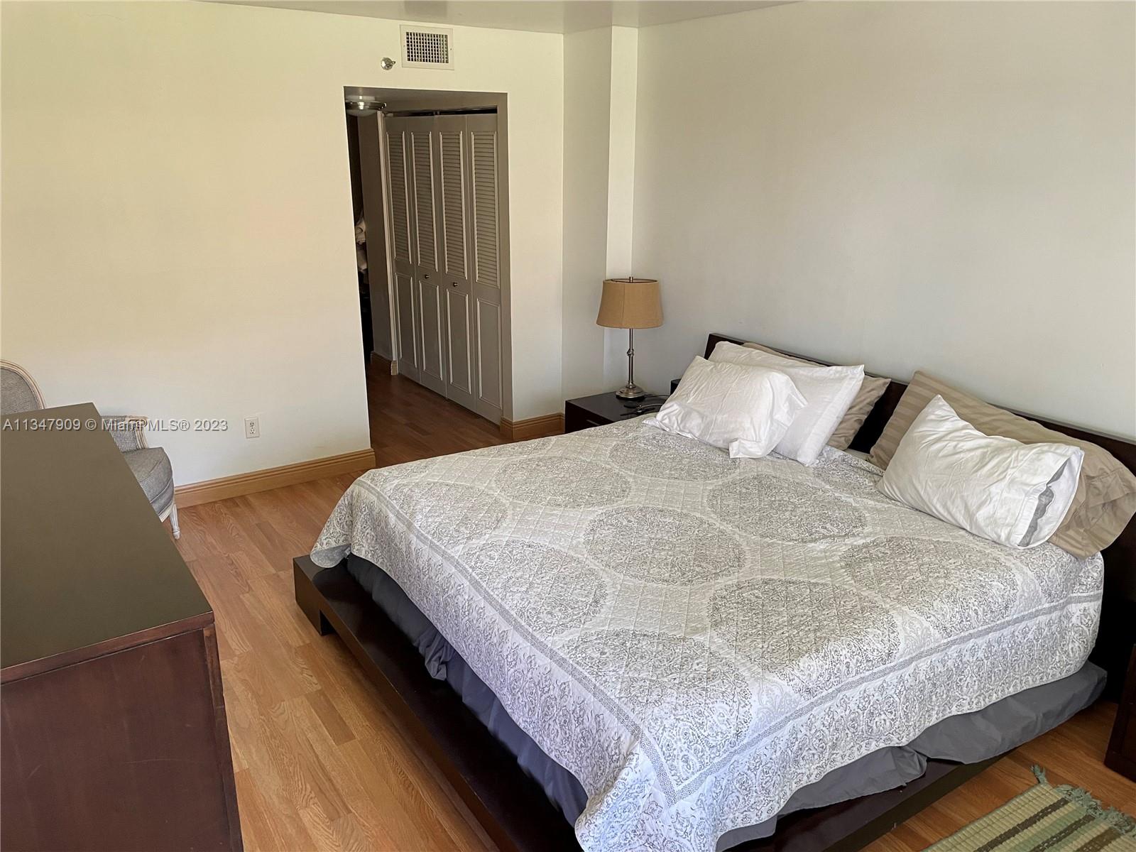 Ives Estates Miami, FL 33179 - Photo 11 of 34 a bedroom with a bed and a window