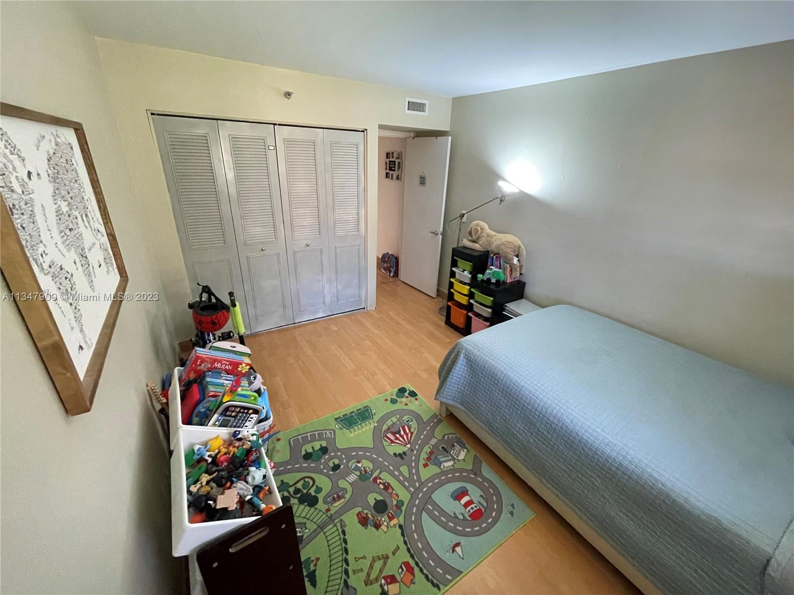 Ives Estates Miami, FL 33179 - Photo 16 of 34 a bedroom with bed and a window