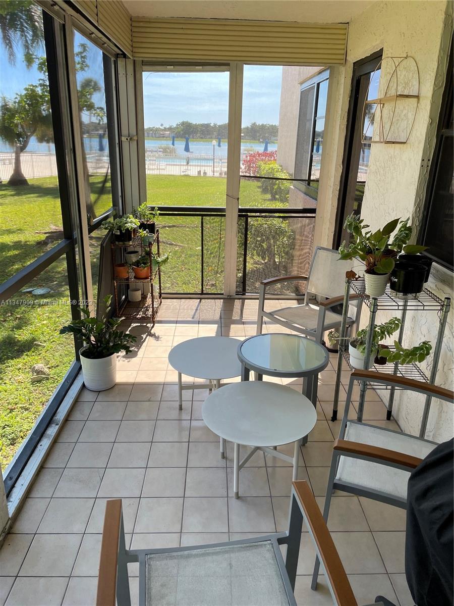 Ives Estates Miami, FL 33179 - Photo 21 of 34 a dining room with furniture and floor to ceiling windows