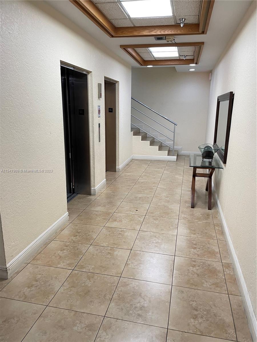 Ives Estates Miami, FL 33179 - Photo 26 of 34 a view of a livingroom with furniture and a hallway
