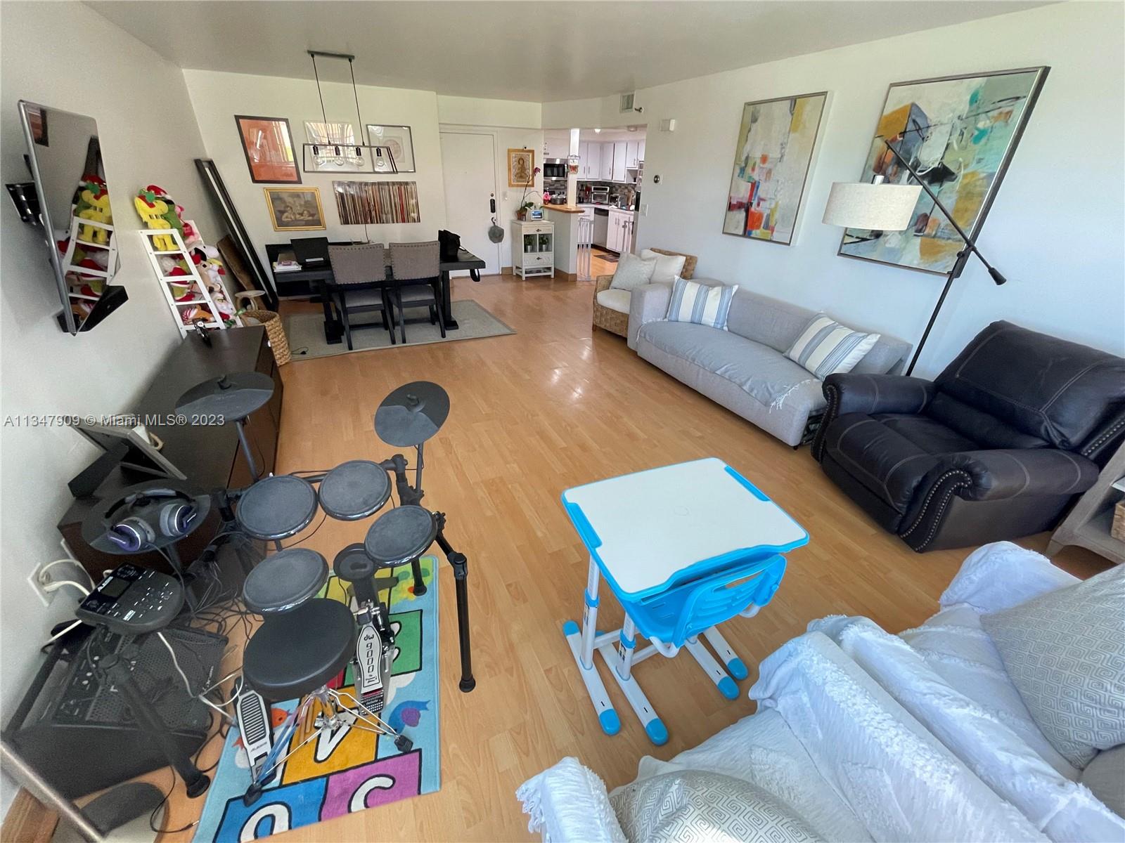 Ives Estates Miami, FL 33179 - Photo 6 of 34 a living room with furniture and a flat screen tv