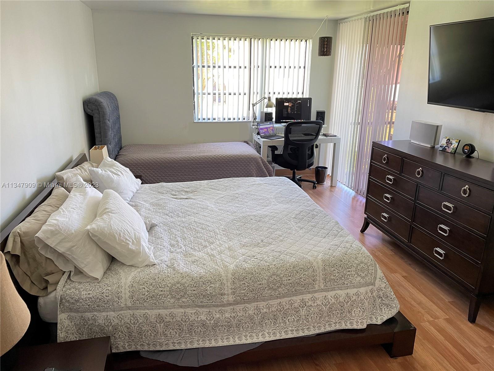 Ives Estates Miami, FL 33179 - Photo 10 of 34 a living room with furniture and a flat screen tv