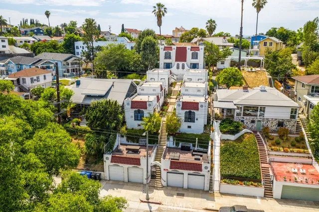 an aerial view of residential houses with outdoor space