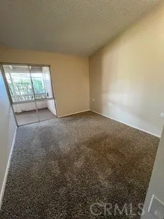 an empty room with a fireplace and painted walls